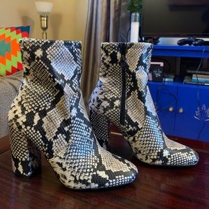 Snakeskin high heeled boots